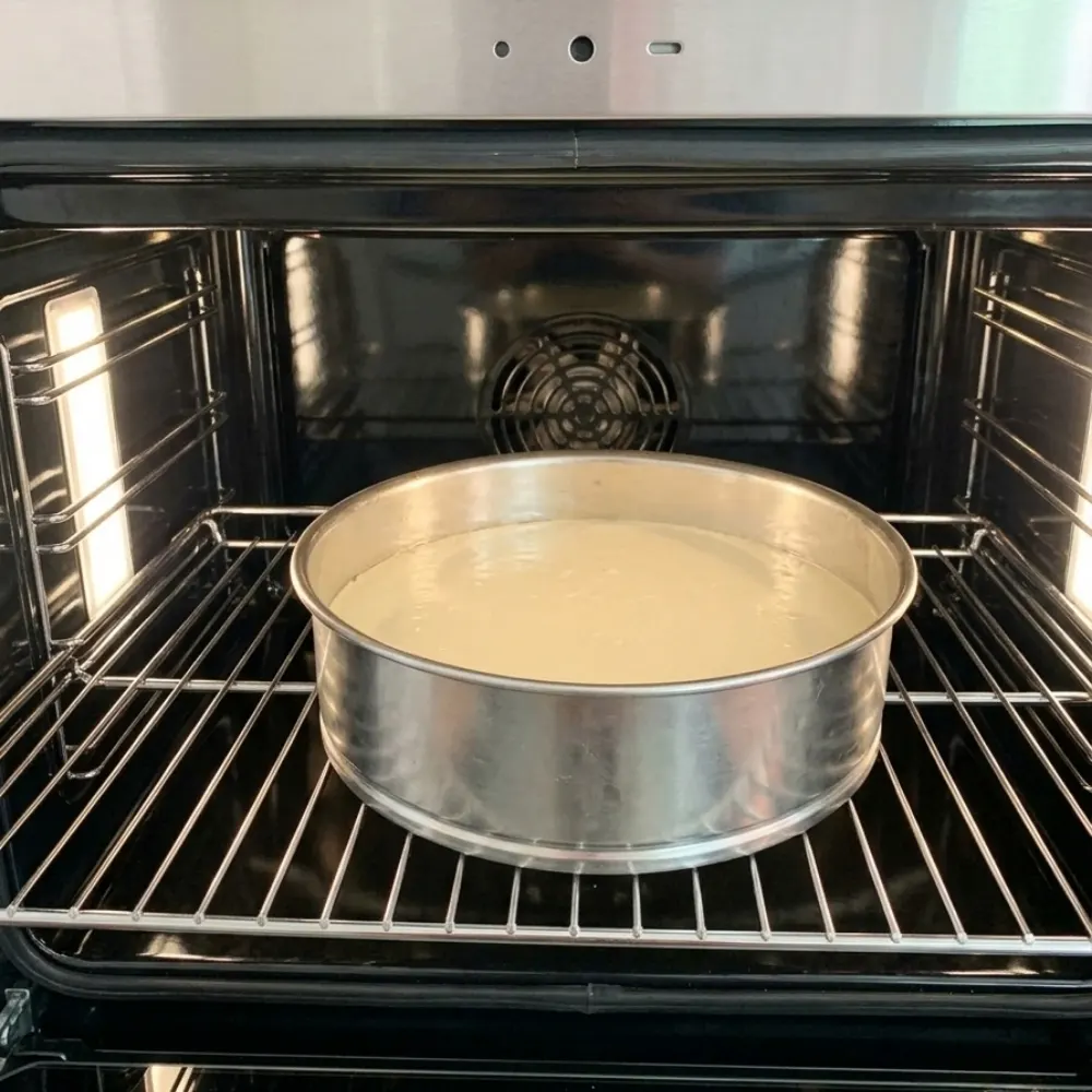 Placing the lemon cheesecake layer in a water bath